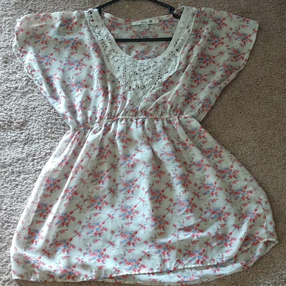 A shirt that has flowers all over it